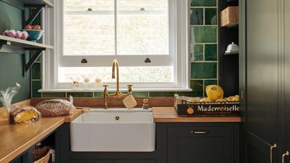 Green tiled pantry by deVOL