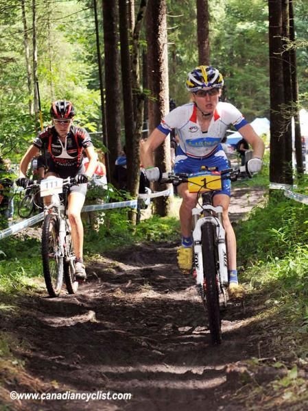 Catherine Pendrel works her way through traffic after two mechanicals.