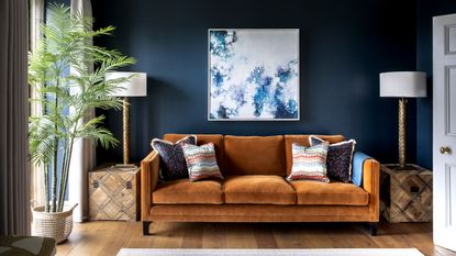 Living room with brown sofa ideas with dark blue walls and brown ochre sofa
