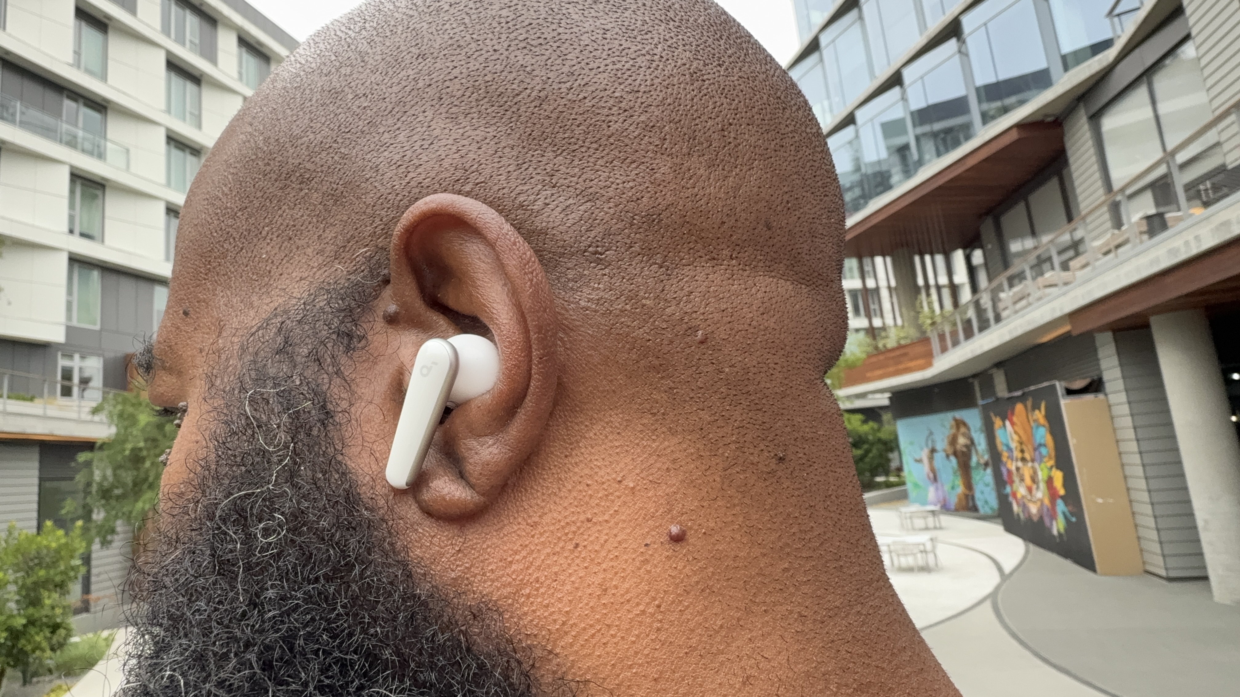 Anker Soundcore Liberty 5 shown being worn by the reviewer