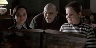 Christina Ricci, Christopher Lloyd, and Jimmy Workman in The Addams Family