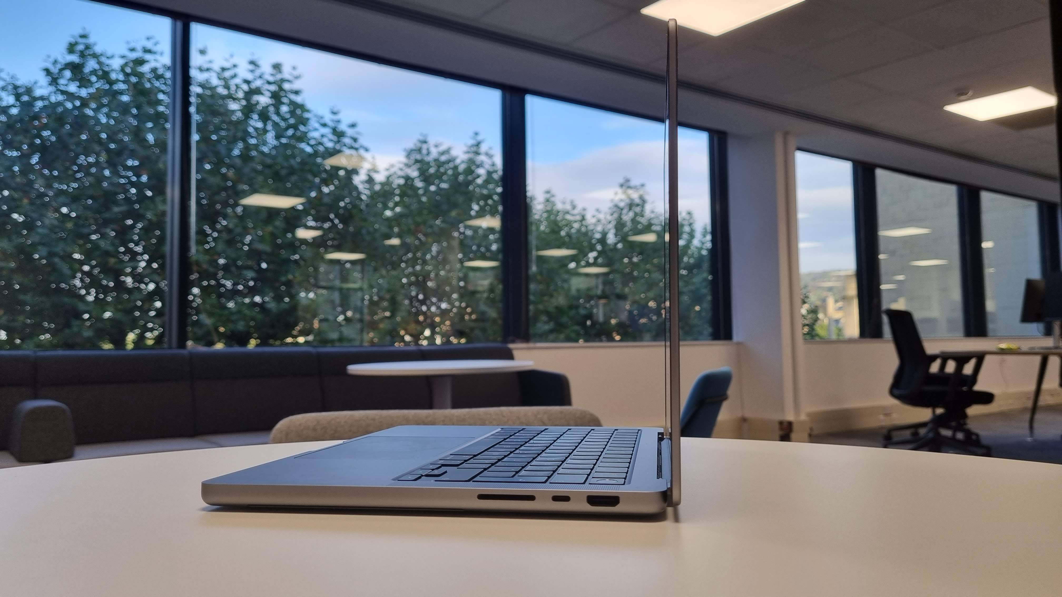 MacBook Pro 14-inch on a table in an office