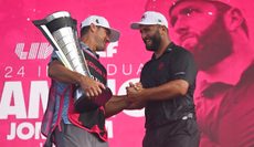 Jon Rahm shakes his caddies hand following his LIV Golf Chicago victory