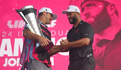 Jon Rahm shakes his caddies hand following his LIV Golf Chicago victory