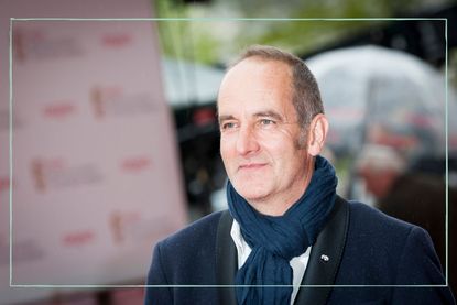 Kevin McCloud picture wearing a navy scarf and looking into the distance