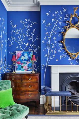 living room with blue printed wallpaper