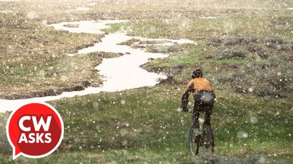 A cyclist riding in the rain