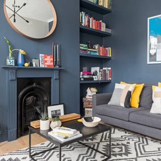 Dark slate grey living room with dark sofa