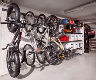inside of garage with bike mounts and bikes along one wall