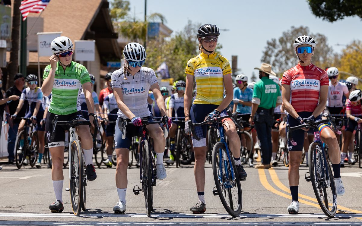 Classificiation Jerseys on the start line. Olivia Cummings (LUX-CTS p/b Specialized) in Green, Haley Smith (ATX Wolfpack p/b ProBikeKit) in White, Emily Marcolini (3T/Q+M Cycling) in Yellow and Diana Penuala (DNA Pro Cycling) wearing Red on behalf of Emily who leads that competition as well.