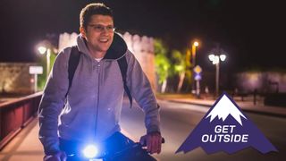 Man cycling with bike lights