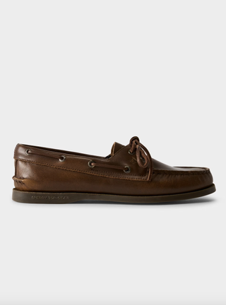 an aritzia boat shoe in front of a plain backdrop