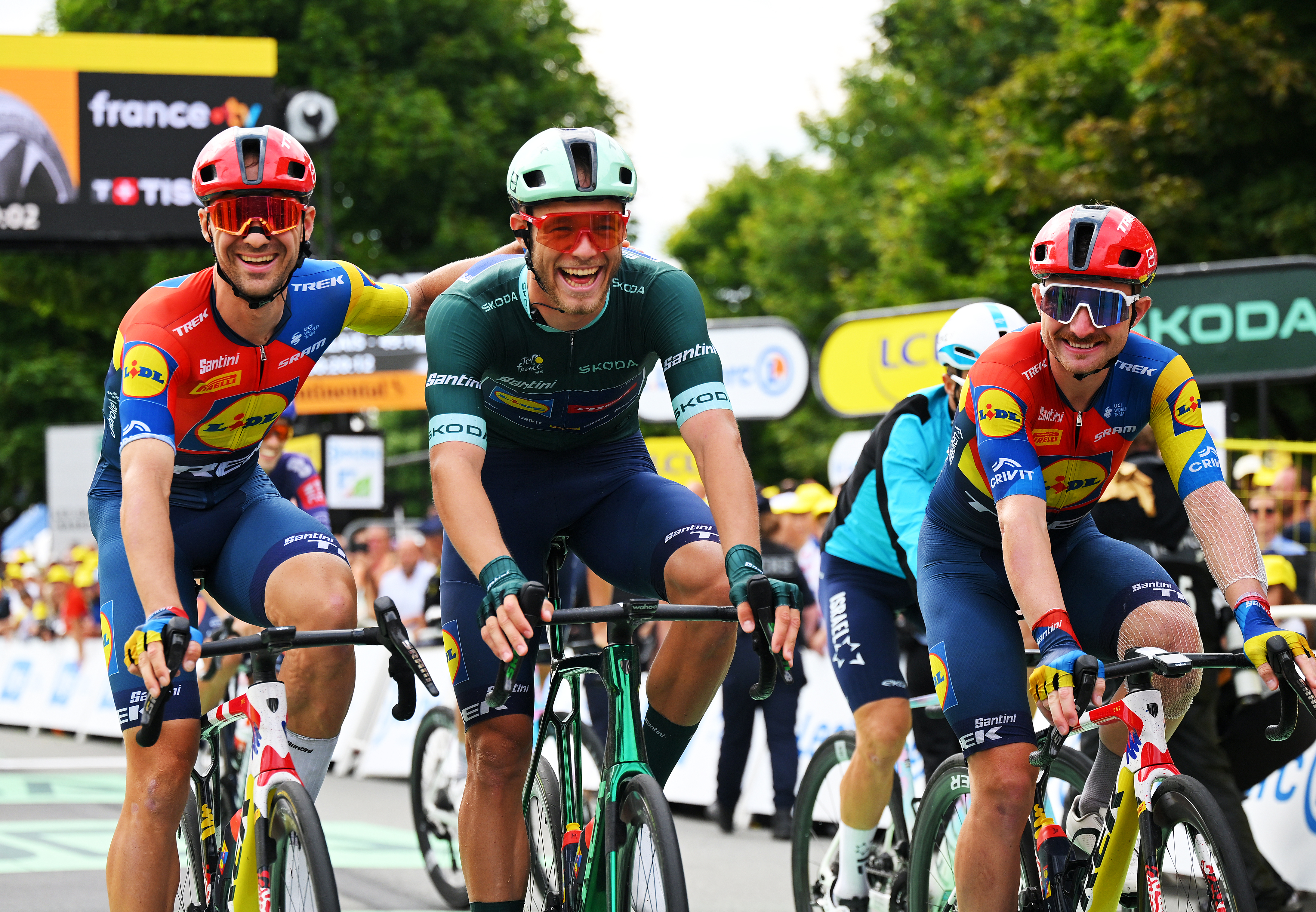 PONTARLIER, FRANCE - JULY 26: (L-R) Edward Theuns of Belgium and Jonathan Milan of Italy - Green Sprint Jersey and Simone Consonni of Italy and Team Lidl - Trek cross the finish line during the 112th Tour de France 2025, Stage 20 a 184.2km stage from Nantua to Pontarlier / #UCIWT / on July 26, 2025 in Pontarlier, France. (Photo by Tim de Waele/Getty Images)