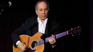 Paul Simon performs at the 2010 Children's Health Fund Benefit Gala at The Hilton New York on June 2, 2010 in New York City