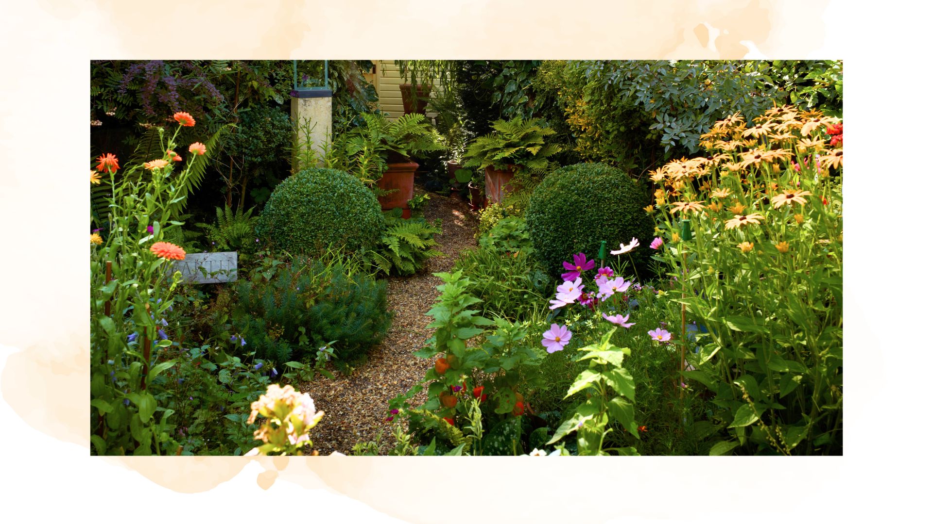 picture of a small garden with lots of plants and small pebble path to highlight small garden mistakes
