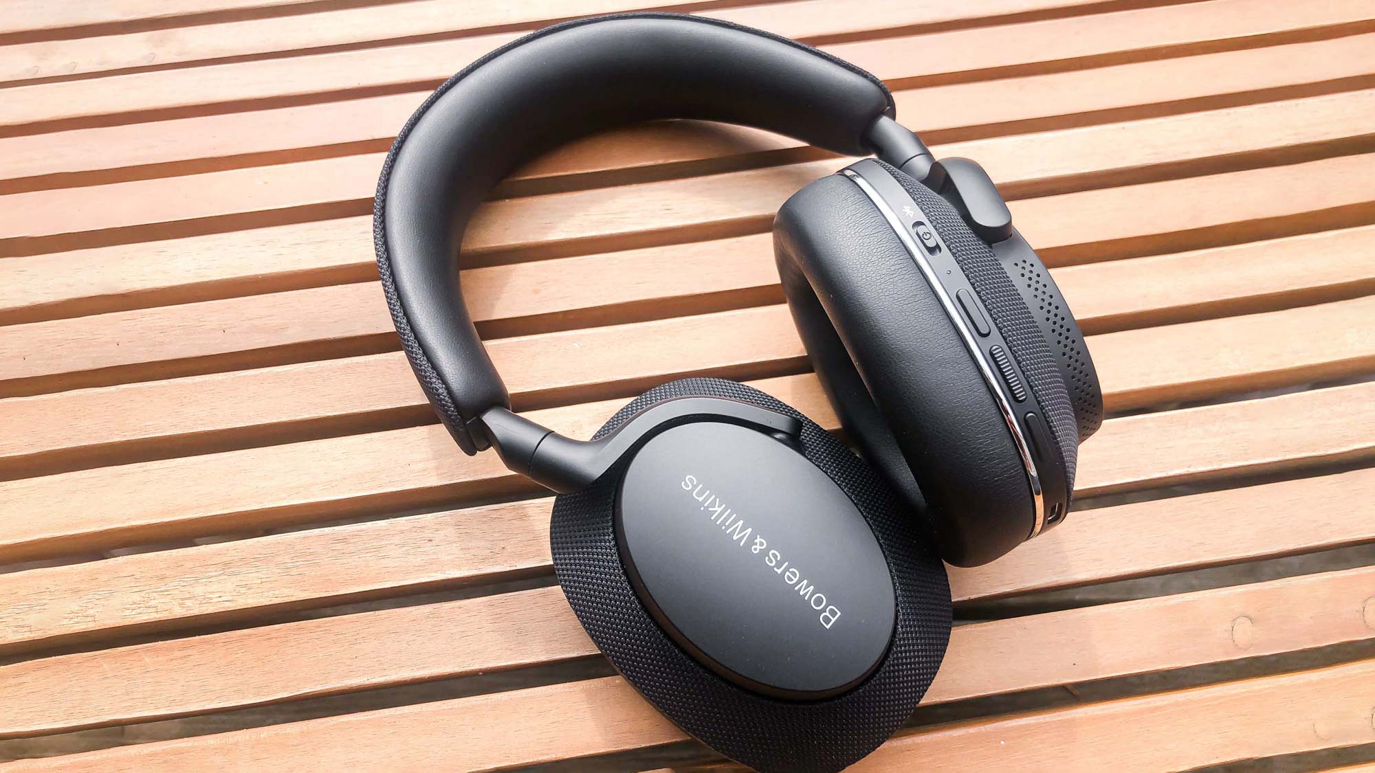 Bowers & Wilkins PX7 S2 headphones outside on a garden table