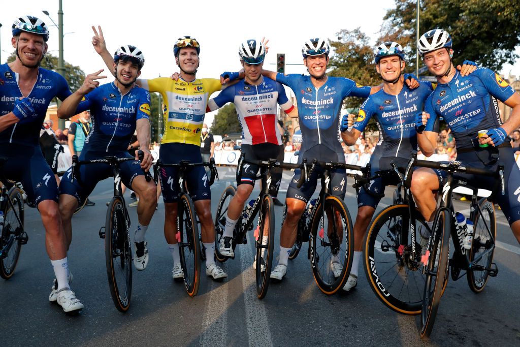 KRAKOW POLAND AUGUST 15 LR Tim Declercq of Belgium Alvaro Jose Hodeg Chagui of Colombia Joo Pedro Gonalves Almeida of Portugal Yellow Leader Jersey Rmi Cavagna of France Stijn Steels of Belgium Mikkel Honor Frlich of Denmark Ian Garrison of The United States and Team Deceuninck QuickStep celebrates at finish line as race lead winner during the 78th Tour de Pologne 2021 Stage 7 a 145km stage from Zabrze to Krakw TourdePologne TDP2021 UCIWT on August 15 2021 in Krakow Poland Photo by Bas CzerwinskiGetty Images