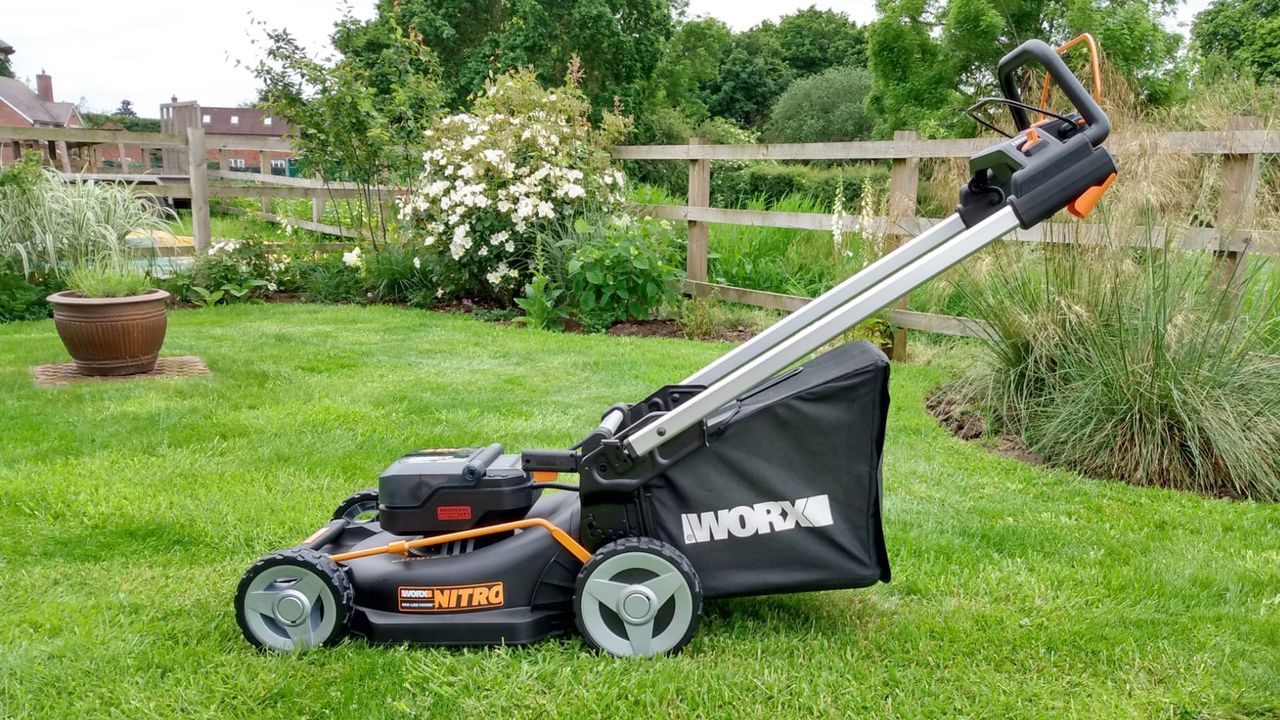 A WORX lawnmower on a green lawn