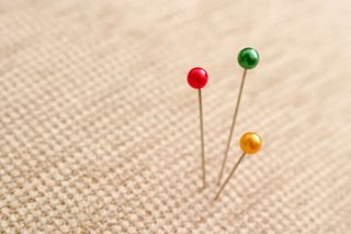 Sewing pins in fabric