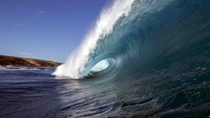 An ocean wave cresting