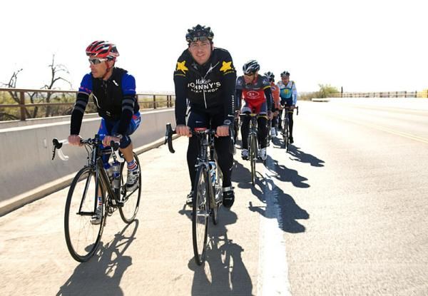 Capital Sports &amp; Entertainment partner Bill Stapleton, right, leads the ride with Armstrong friend Jimmy Riccitello.