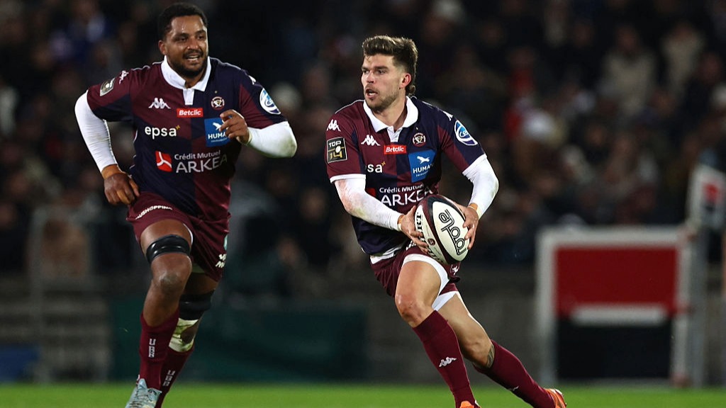 Fly-half Matthieu Jalibert of Bordeaux prepares to throw a pass during a Top 14 fixture.