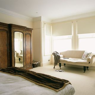 bedroom with double bed and sofa