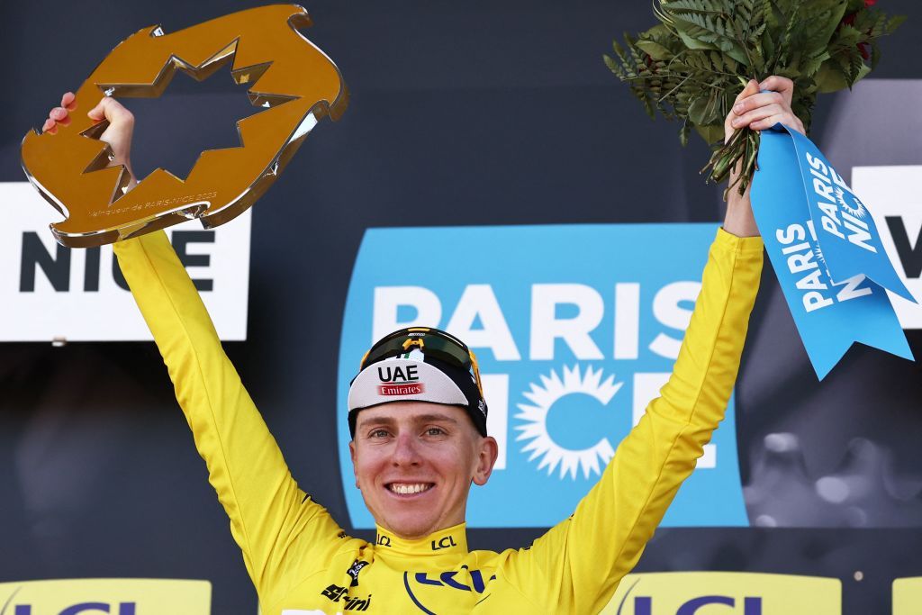 First placed overall winner UAE Team Emirates Slovenian rider Tadej Pogacar wearing the overall leaders yellow jersey celebrates with his trophy on the overall podium after winning the 8th and final stage of the 81st Paris Nice cycling race 1175 km between Nice and Nice in French riviera city of Nice southeastern France on March 12 2023 Tadej Pogacar won a third stage of the ParisNice race on March 12 2023 to take a crushing overall victory in his first entry to the prestigious eightday event Photo by AnneChristine POUJOULAT AFP Photo by ANNECHRISTINE POUJOULATAFP via Getty Images