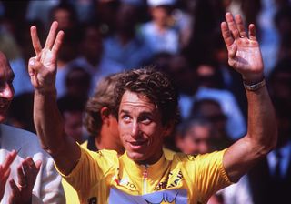JUL 1990 GREG LEMOND USA CELEBRATES ON THE PODIUM WEARING THE YELLOW JERSEY AFTER WINNING THE 1990 TOUR DE FRANCE IN PARIS THE VICTORY WAS LEMONDS THIRD IN THE TOUR DE FRANCE Mandatory Credit Tony DuffyALLSPORT