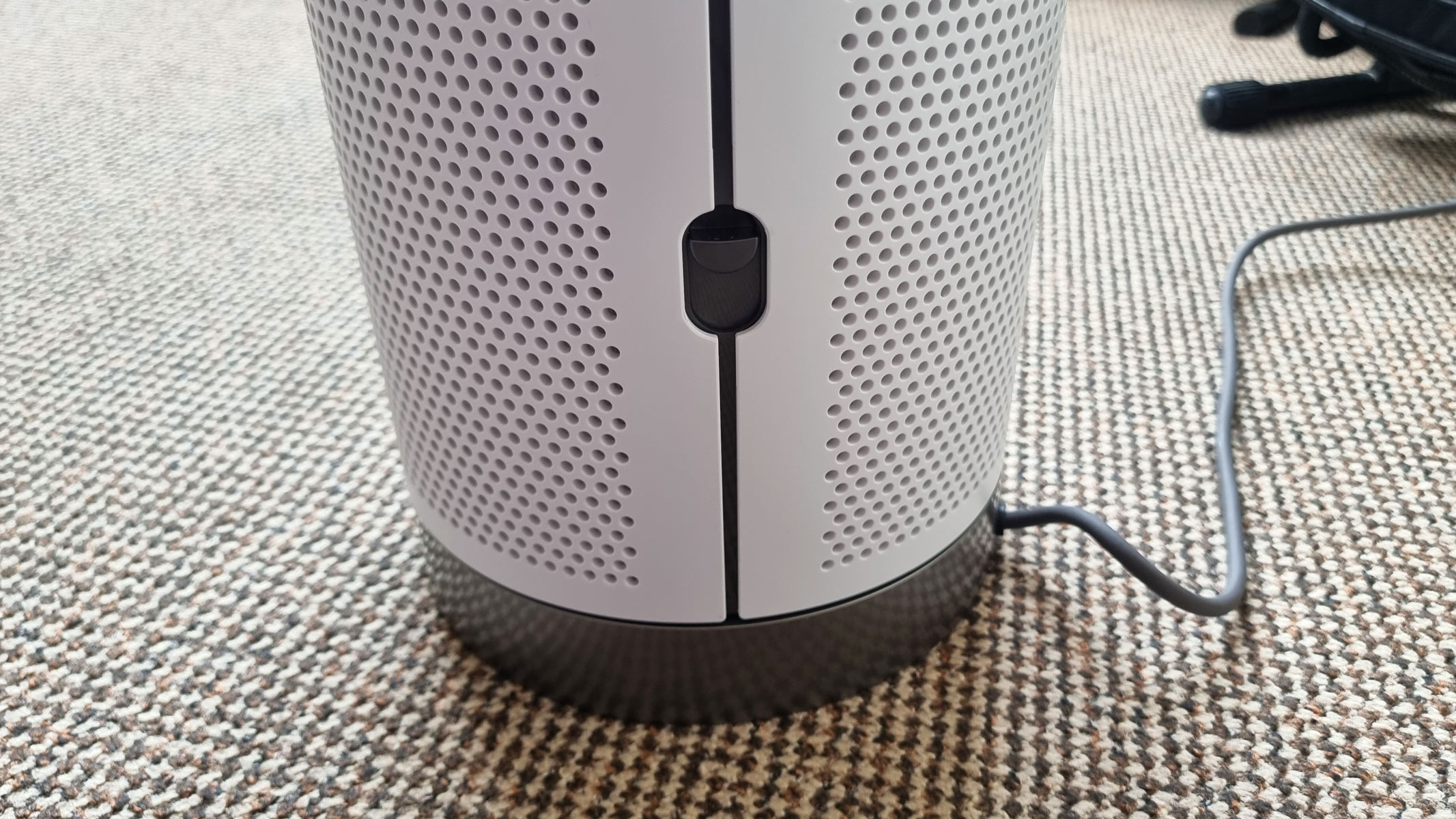 Dyson Purifier Cool PC1, a close-up picture of the filter cover release mechanism