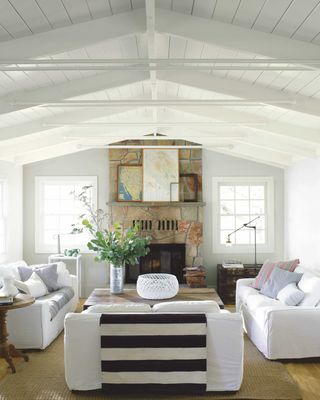 White living room in bar conversion with double-height ceilings