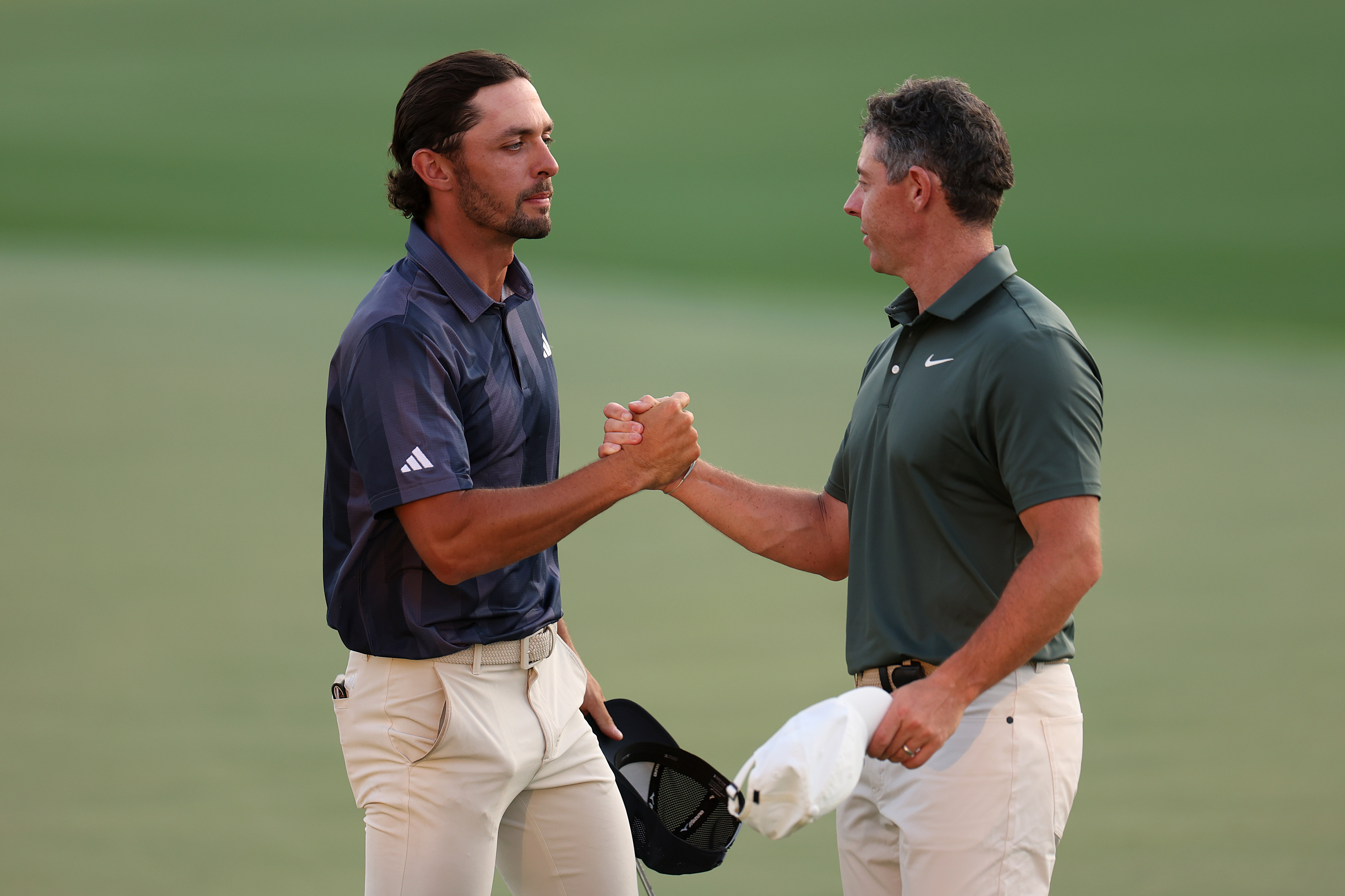 Marco Penge shakes hands with Rory McIlroy