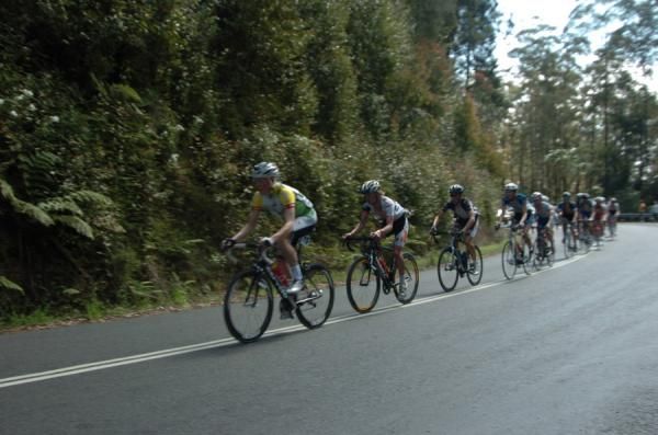 The peloton crests Gibraltar with Racing Kangaroos rider Michael Troy leading them,