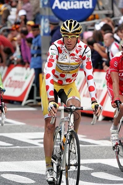 Millar crosses the line after being held up behind the crash