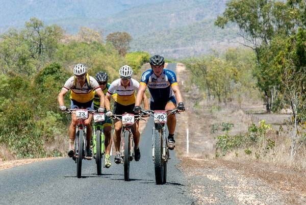 Leading amateur women Kristin Endres (#107) in a peloton with para-athlete Arnout Matthys (BEL).