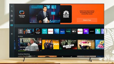A Samsung TV on a stand loaded to Samsung TV Plus