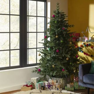 Habitat 7ft Natural Upswept Mixed Tip Christmas Tree in a living room