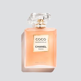 Chanel Coco Mademoiselle l'eau Privee in beige square bottle against grey background