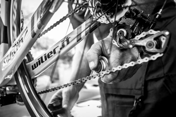 A mechanic gets one of the new Wilier bikes ready for the day