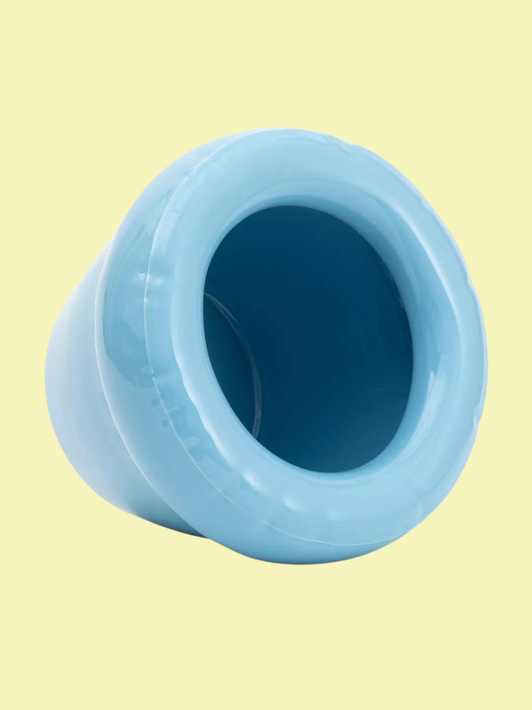 A inflated-style ceramic planter in baby blue from Home Studyo