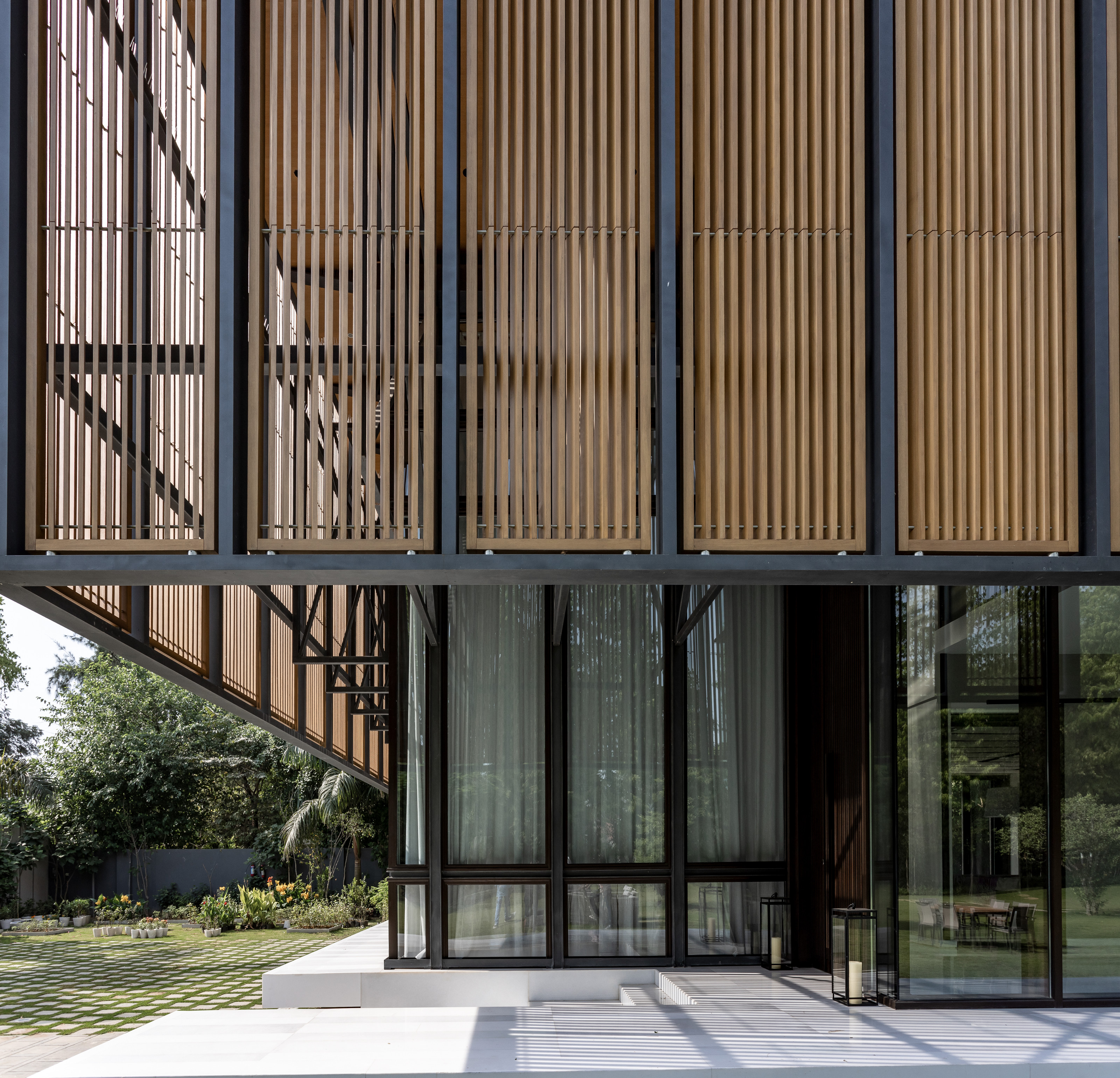 A detail of the timber screen shading the double-height living space