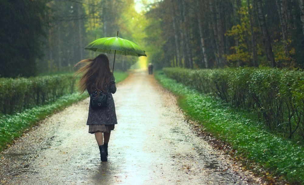 Girl walking in the rain