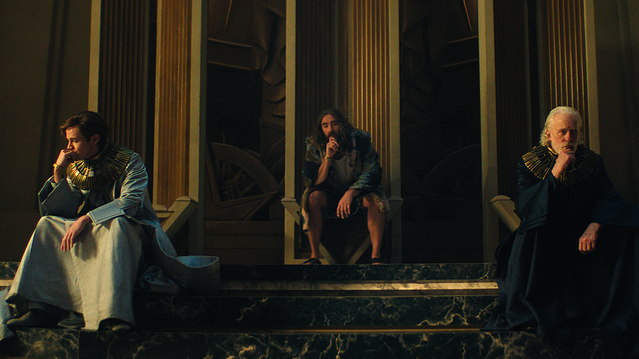 Brother Dawn, Brother Day, and Brother Dusk sitting in their throne room in Foundation season 3