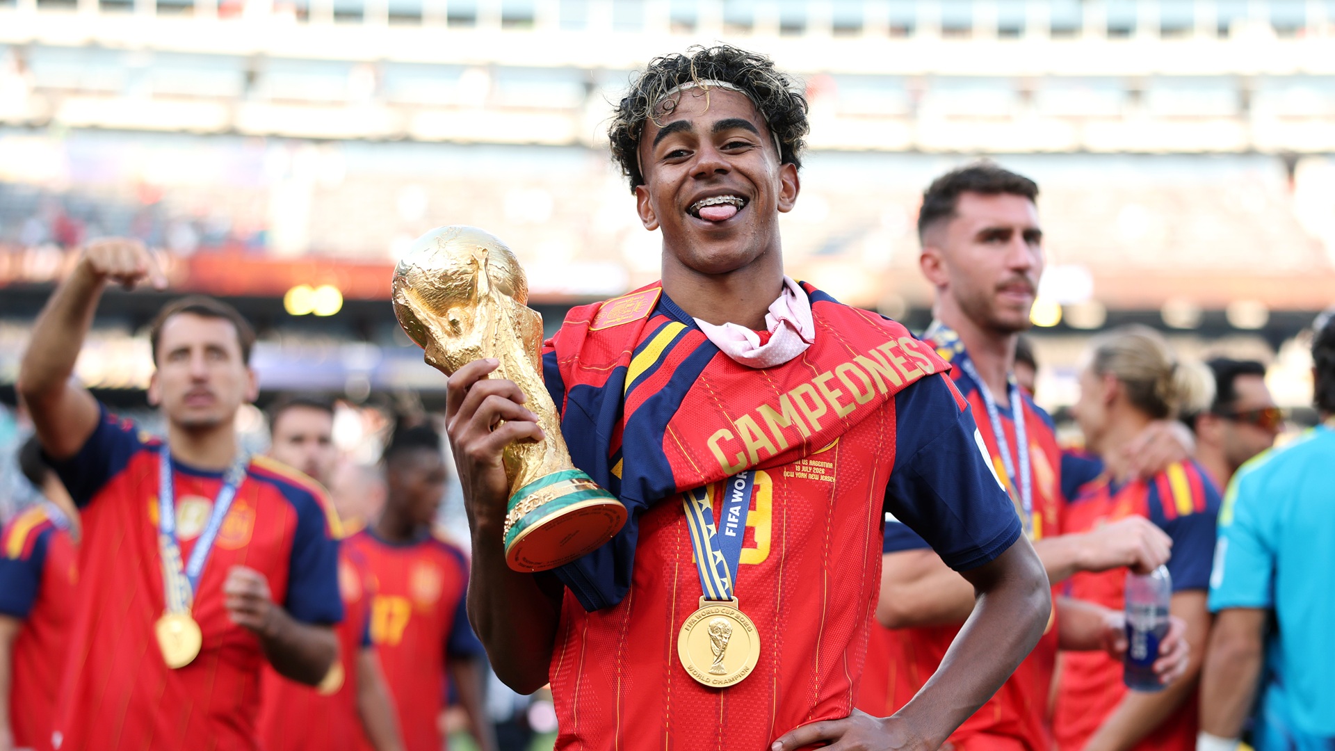 Lamine Yamal #19 of Spain celebrates with the FIFA World Cup Winner&amp;rsquo;s Trophy.