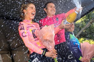 Kristen Faulkner (centre) celebrates winning stage 2 at Trofeo Ponente in Rosa, with teammate Kim Cadzow in second