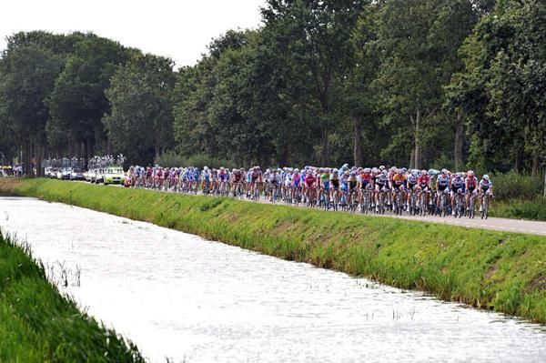 The group rides along a canal in The Netherlands.