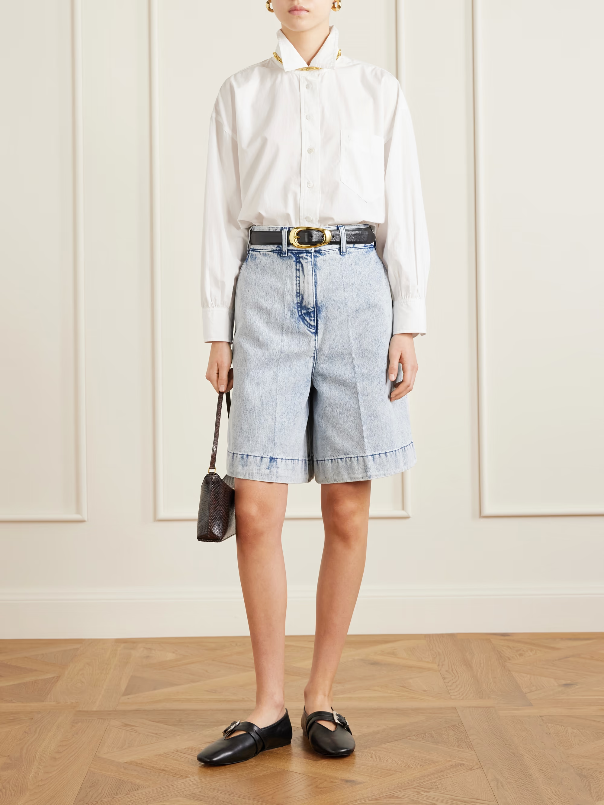 A model wearing Patou denim bermuda shorts.