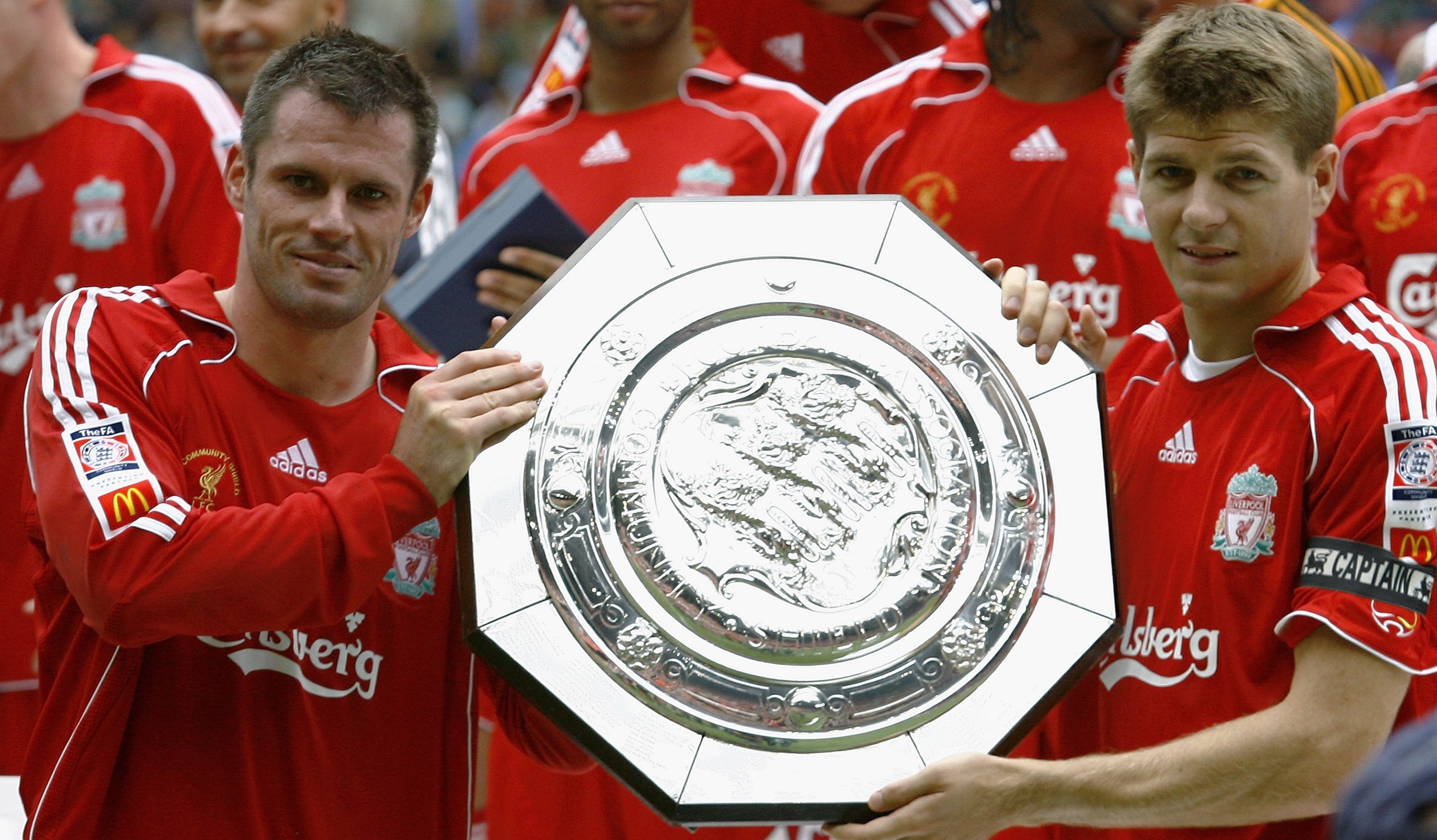 Jamie Carragher (L) and Steven Gerrard of Liverpool hold the trophy following their team's win in the FA Community Shield against Chelsea at the Millennium Stadium on August 13, 2006 in Cardiff, Wales
