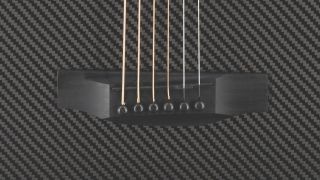 The bridge of a Klos Grand Cutaway Mini guitar