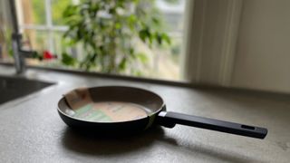 Salter Ceramic Non-Stick Frying Pan in its packaging on the counter